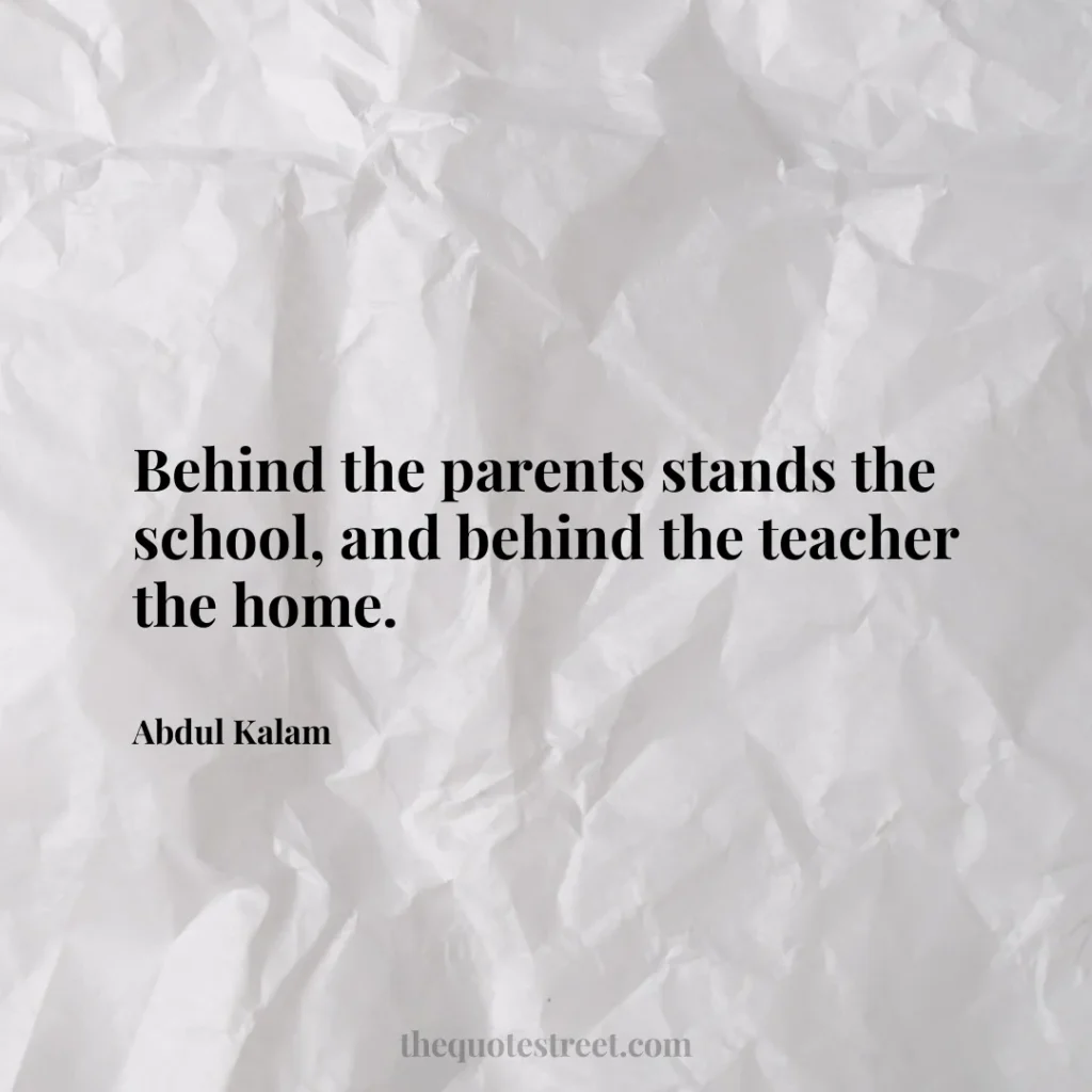 Behind the parents stands the school